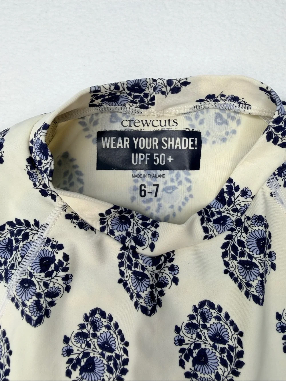 J.Crew long-sleeve rash guard featuring an all-over navy and white floral 6-7